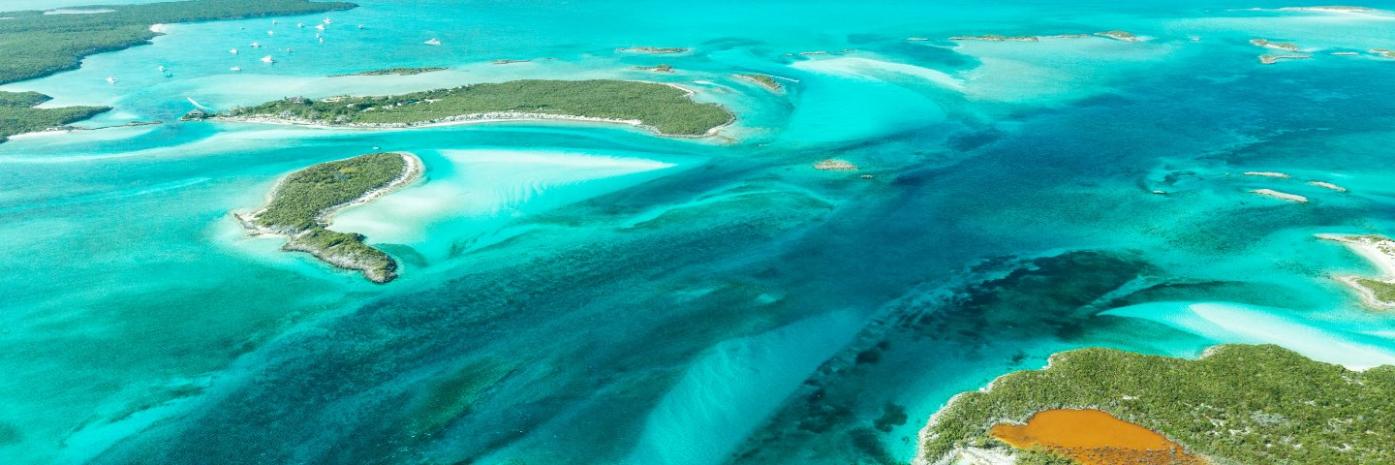 Different shades of blue and green swirl in the ocean water.