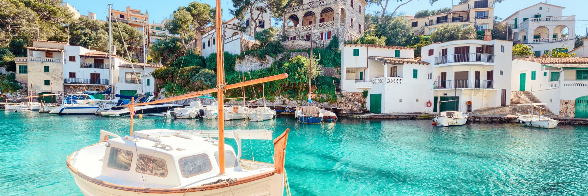 Beautiful marina with aquamarine waters and houses.