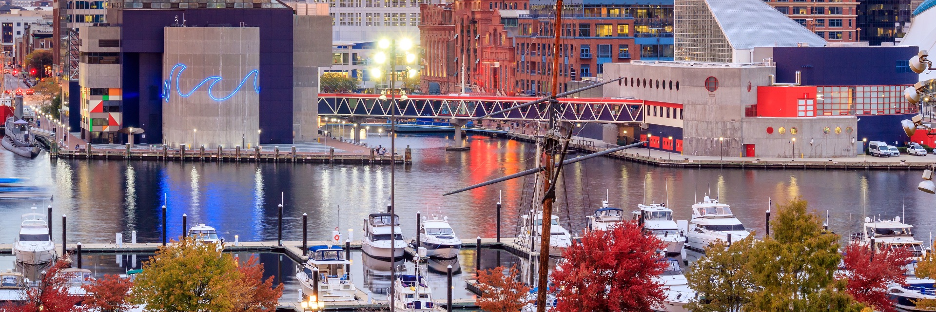 View of Inner Harbor area in large city downtown white sun sets.