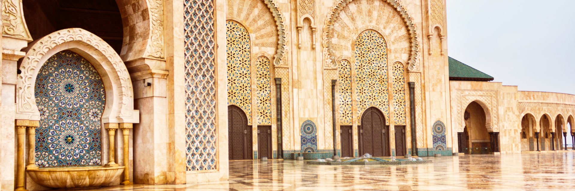 Ornate pillars and arches of an old building.