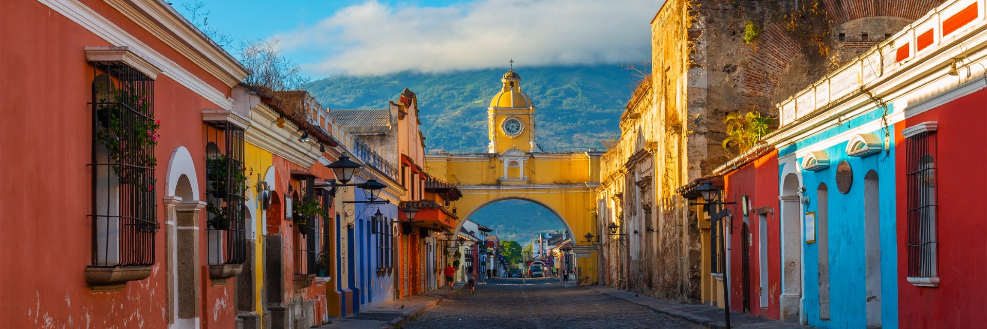 A colorful old town at the foot of a mountain.