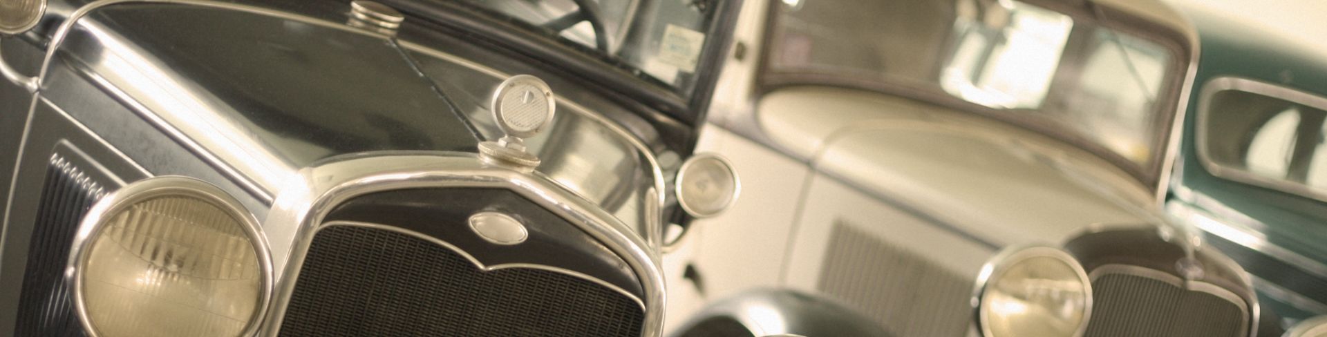 A collection of Ford Model T cars from the early 1900s.