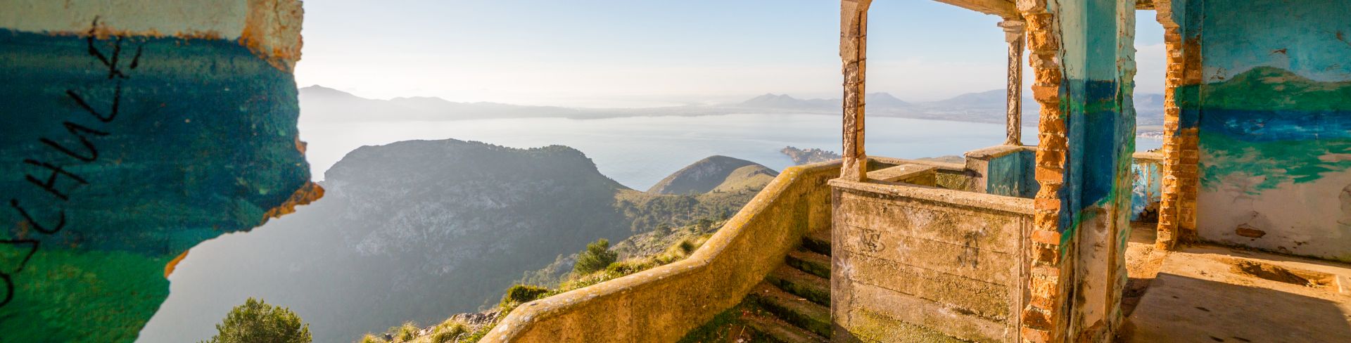 The view of the mountains and bay of Mallorca from the ruins of an old building.