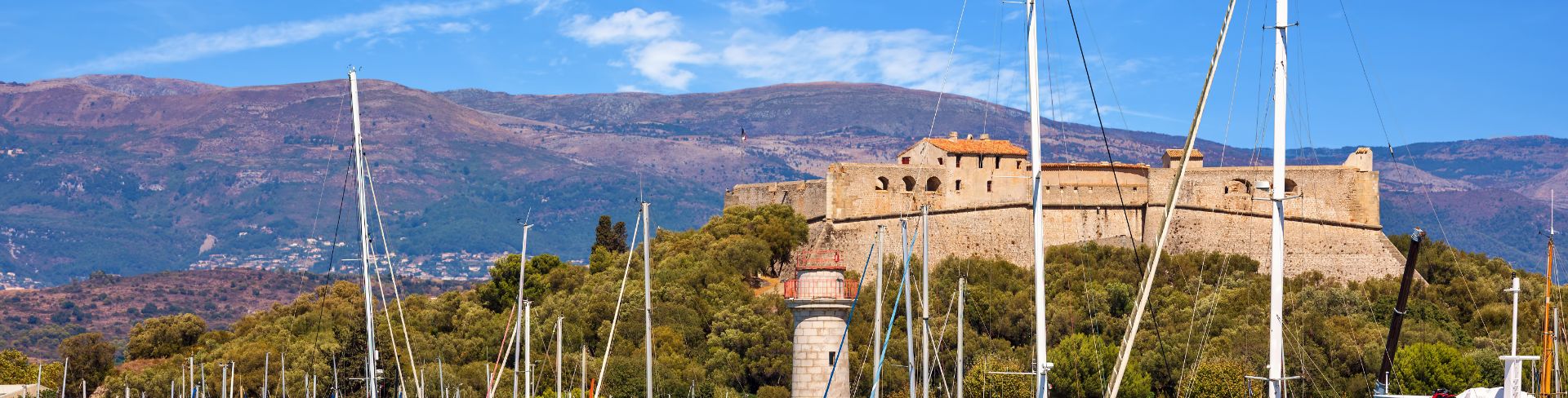 Luxury sail boats and yachts at anchor in the port of Antibes on the French Riviera.