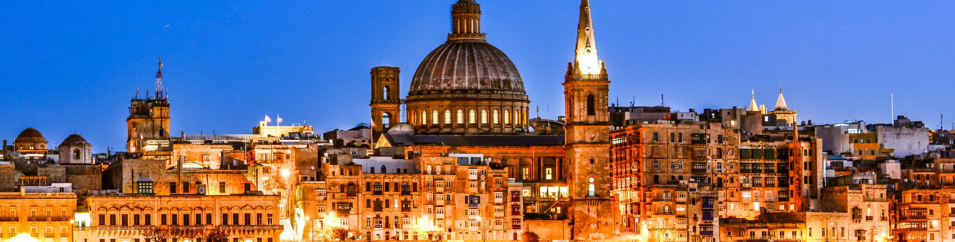 The view of the old buildings, domes and spires of Valletta, overlooking the harbor.