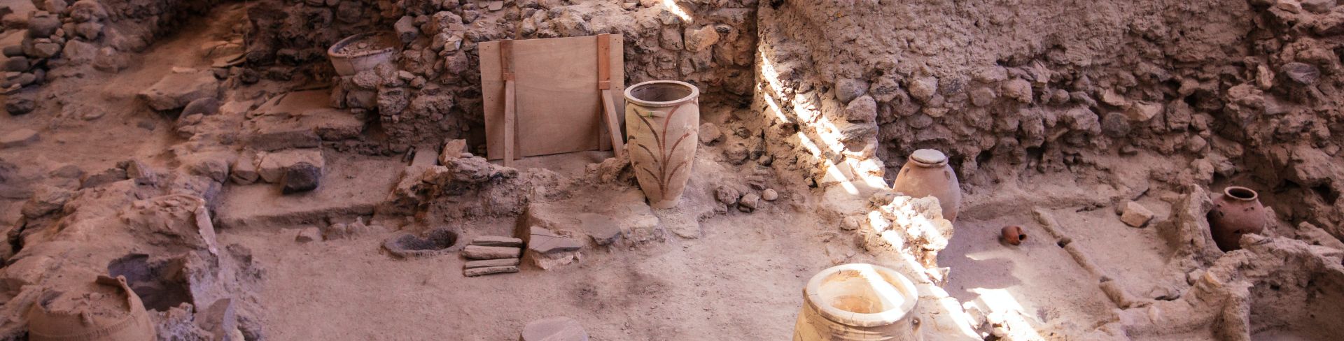 Ancient ruins of a Cycladic Bronze Age settlement catch a ray of light.
