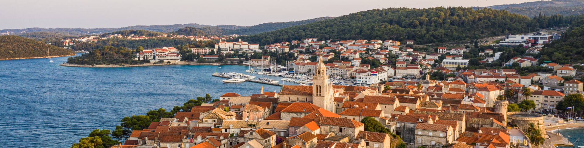 Aerial view of Korcula with its orange roof in the evening light.