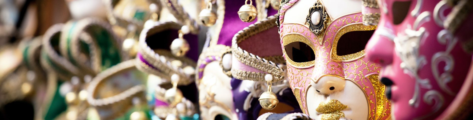 Colorful traditional Venetian masks are on display.