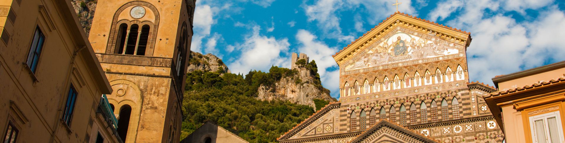 The Duomo di Amalfi, a medieval cathedral, at sunset.