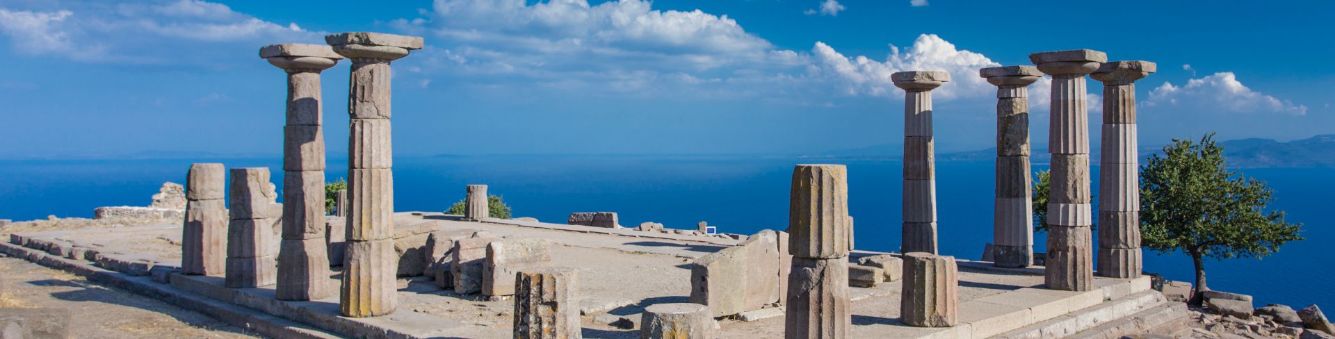 The ruins of the Temple of Athena in Assos overlooking the sea.