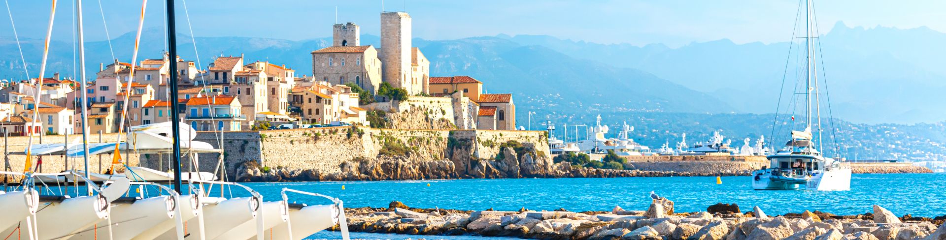 The view of Antibes from a rocky beach.
