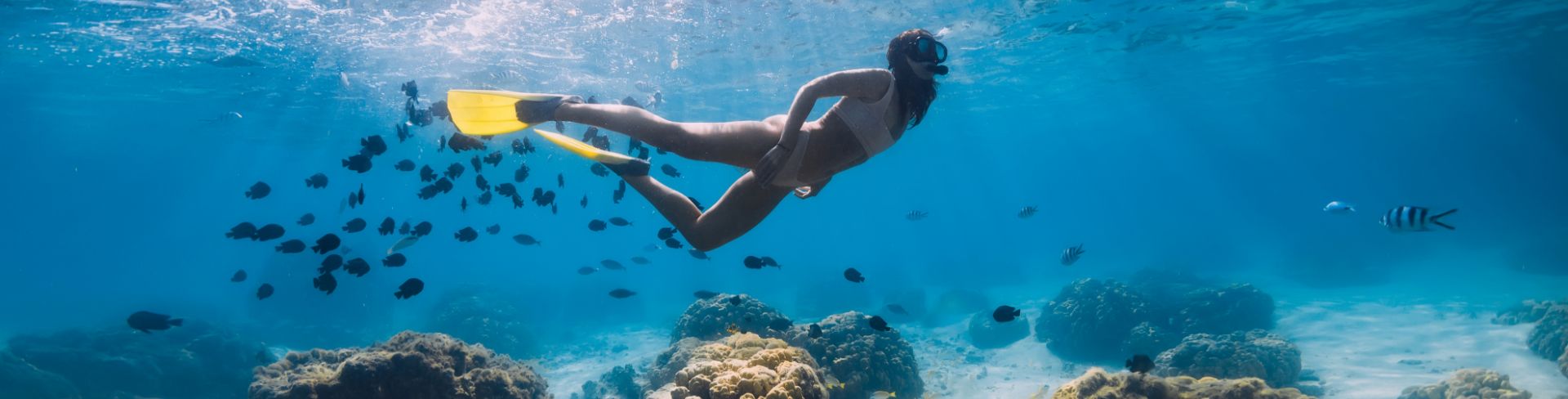 A woman snorkling near Paxos and Antipaxos in Parga, Greece.