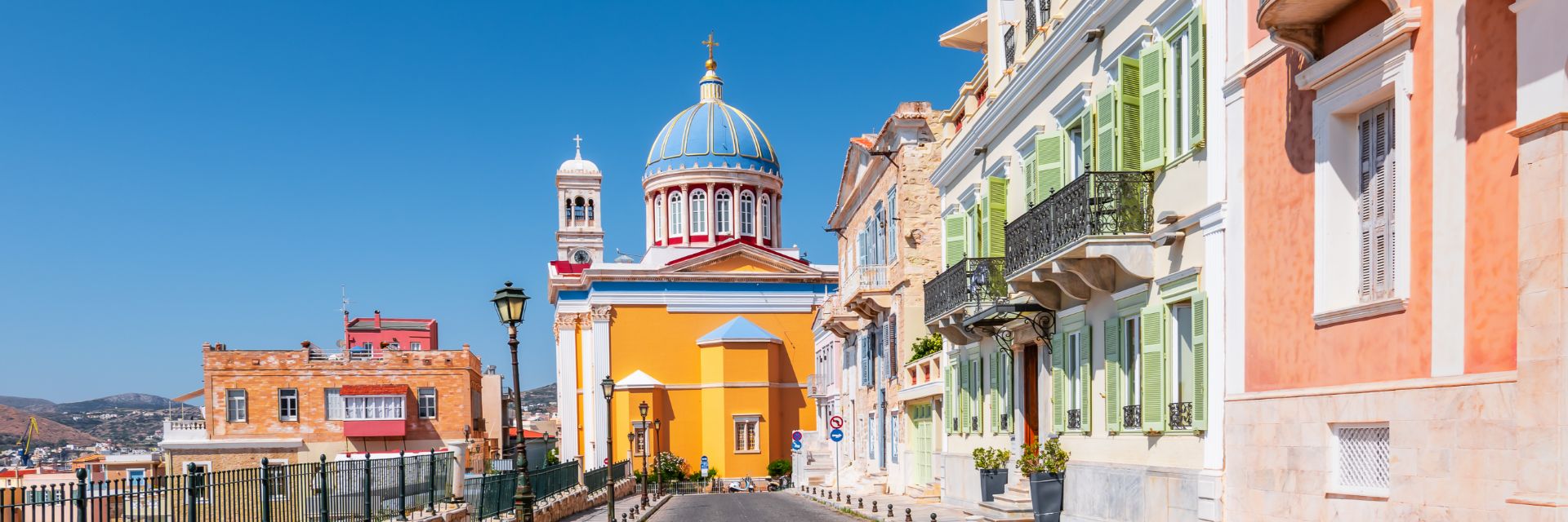 The neoclassical pastel-colored buildings of Ermoupoli on Syros, Greece.