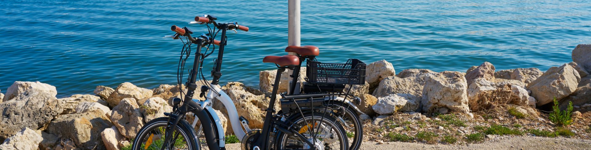 Two bicycles parked at Marina de Denia in Alicante, Spain.
