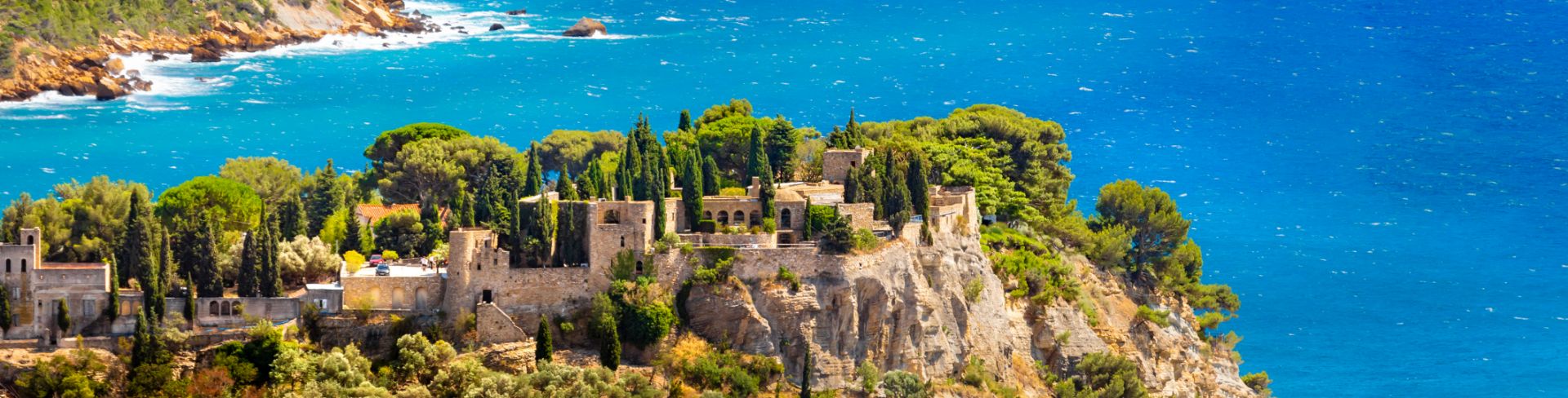 An aerial view of old Cassis in Provence with the Mediterranean Sea in the background.