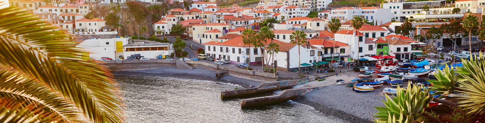 A scenic aerial view of Camara de Lobos village in Madeira.