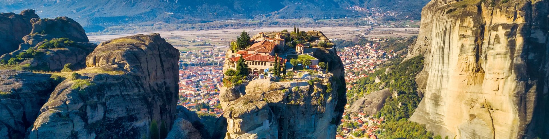 Large rocky landscape with mountains in the background