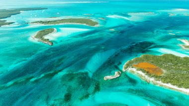 Different shades of blue and green swirl in the ocean water.